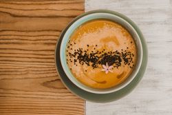 Tasty soup puree with seeds in bowl