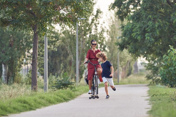 Happy mother with baby playing outdoors