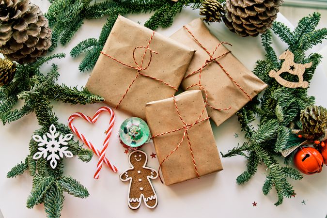 Christmas gifts and decorations arranged with coniferous twigs and cones