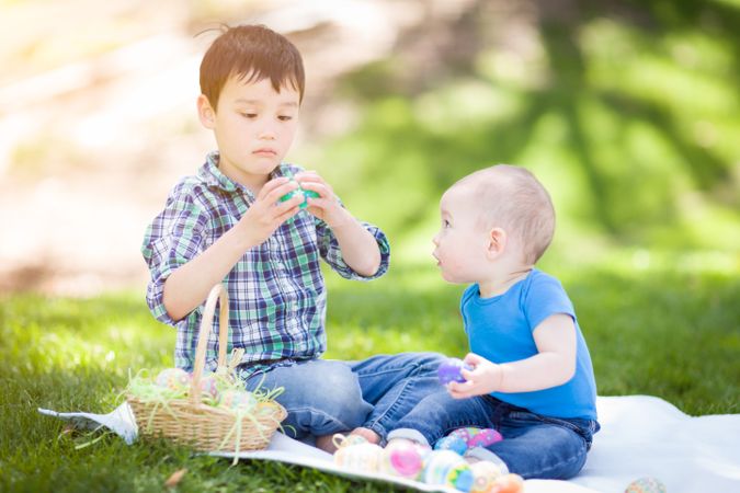 Boys in Park Playing with Easter Eggs