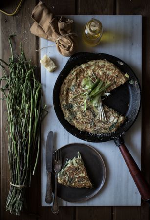 Tortilla with fresh green in skillet pan