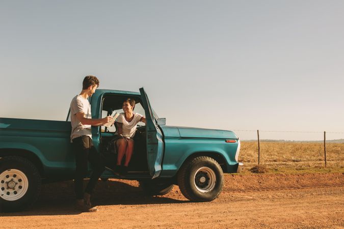 Young couple enjoying road trip in the country side