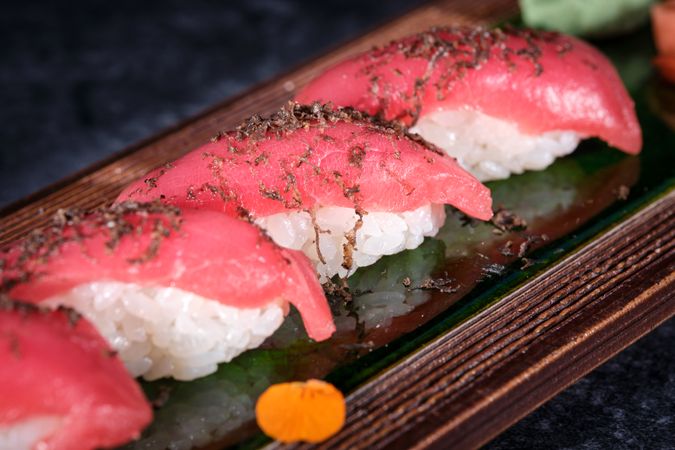 Delicious sushi set served on wooden tray