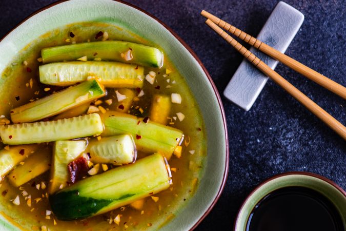 Traditional Chinese cucumber meal served with chopsticks