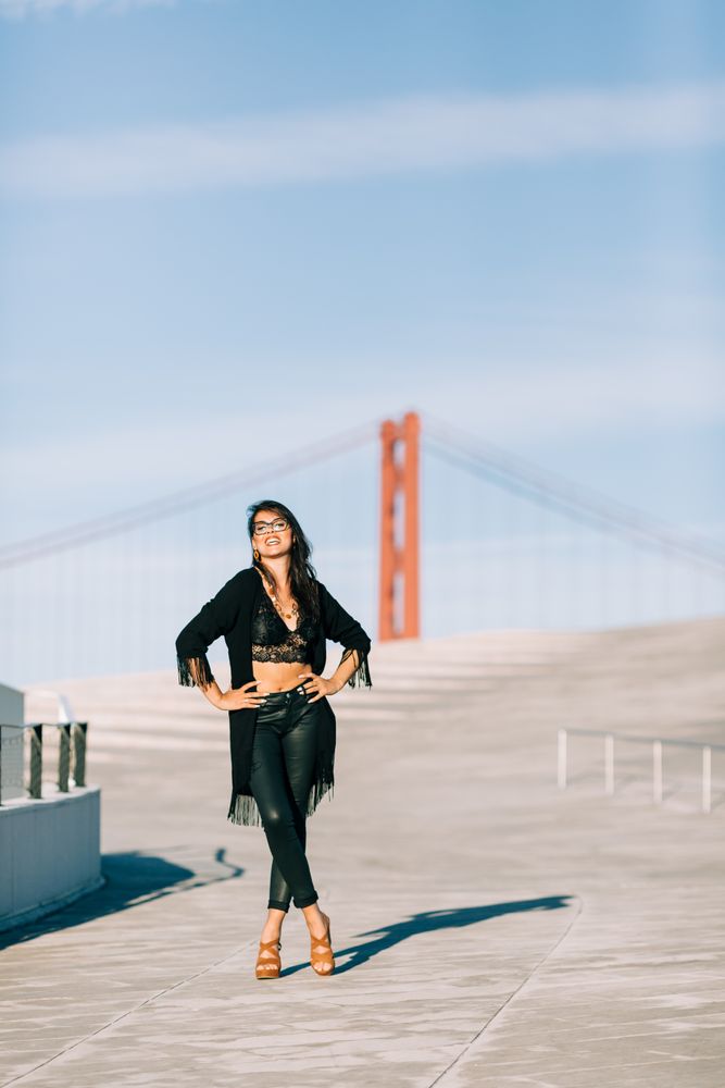 Trendy female standing on urban background