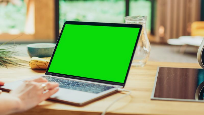 Close Up Green Screen Mock Up on Laptop Computer.