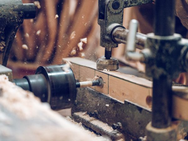 Lathe machine drilling wooden detail