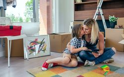 Mother and son playing the tablet and kissing
