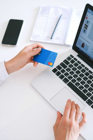 Person online shopping with credit card