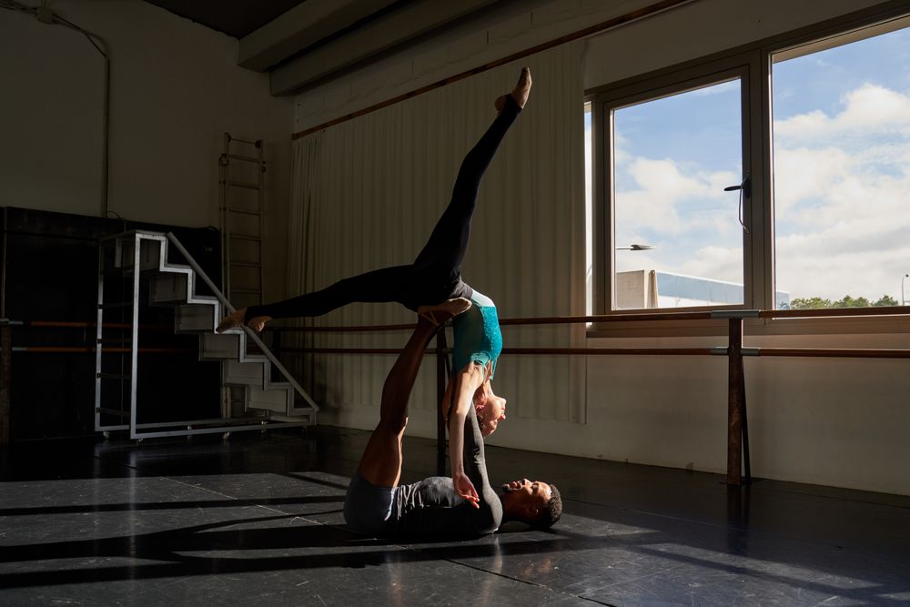 Man and woman in a class doing a training in ballet academy