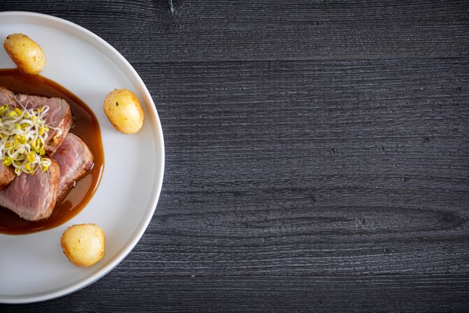Duroc sirloin with orange ginger soy and potatoes