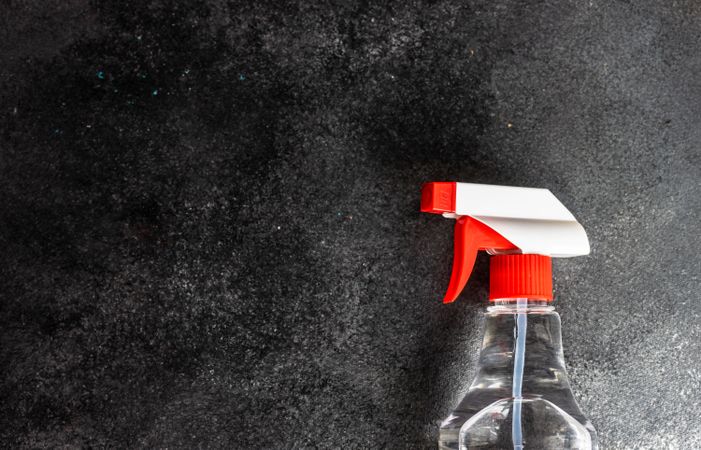 Top view of washing up spray bottle on grey counter