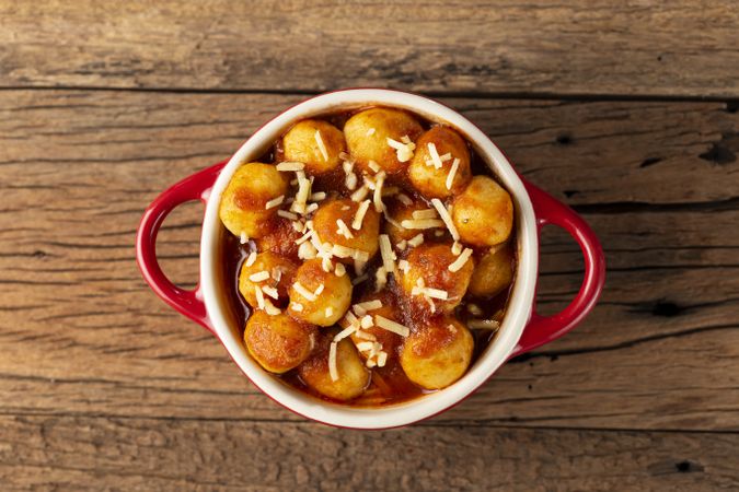 Gnocchi with tomato sauce and grated Parmesan cheese.
