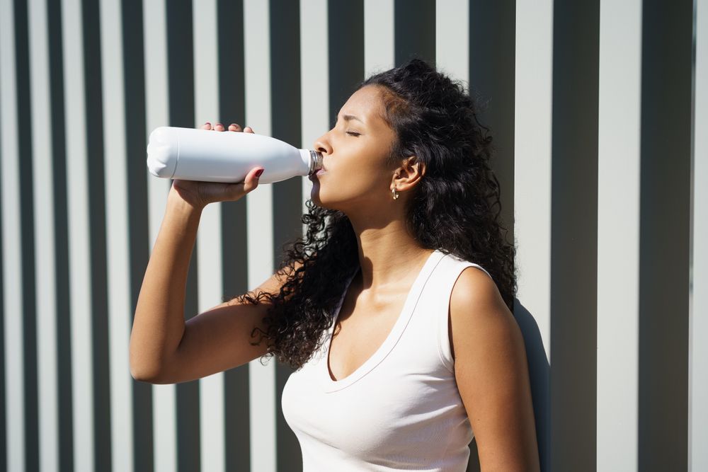 Enjoy a Refreshing Drink in the Bright Sun A Perfect Blend of Hydration and Wellness