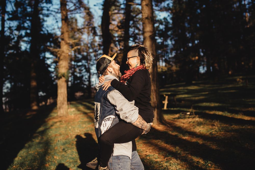 Happy young couple hugging in park