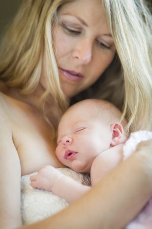Mother Holding Her Newborn Baby Girl