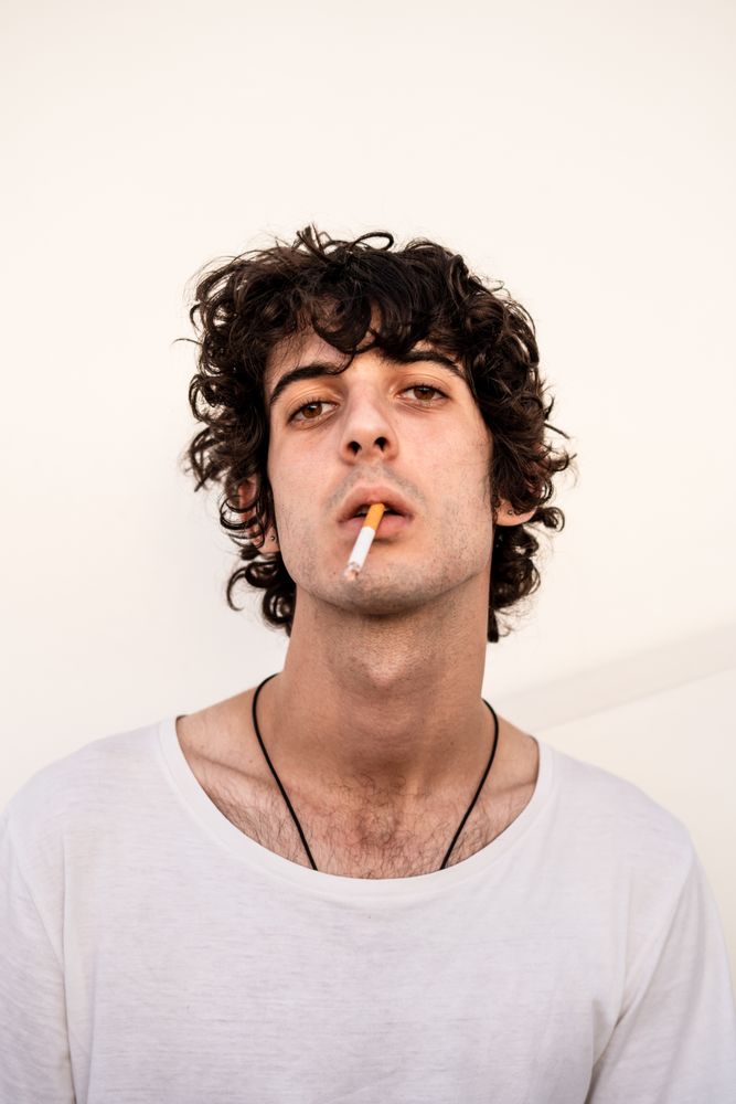 Adult smoker looking at camera