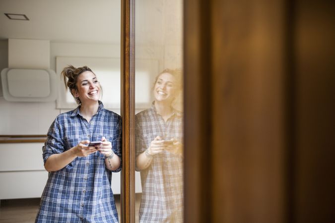 Woman at home on the mobile phone