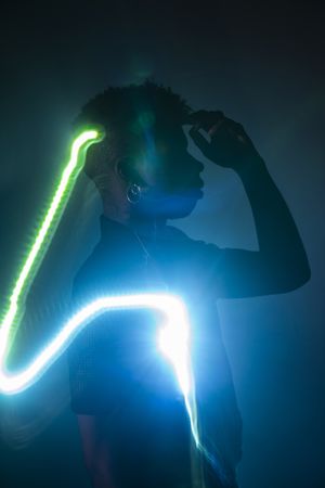 Traces of light on faces of dancer