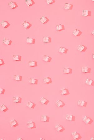 Ice cubes pattern on pastel pink background