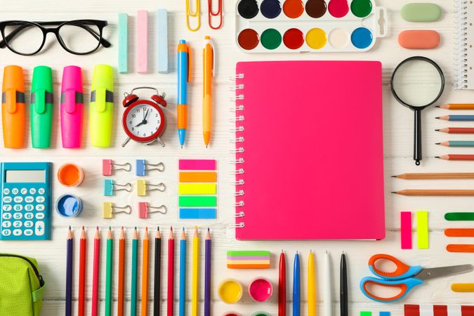 Flat lay composition with school supplies on wooden background