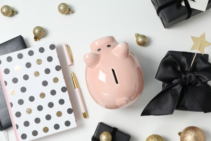 Concept of Christmas finance with piggy bank, top view