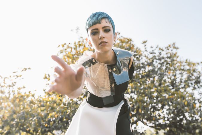 Futuristic woman reaching out camera
