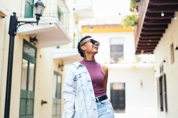 Portrait of a cool Latin American woman walking in the city