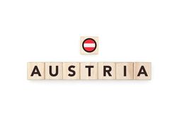 Wooden blocks bearing the name and flag of Austria.