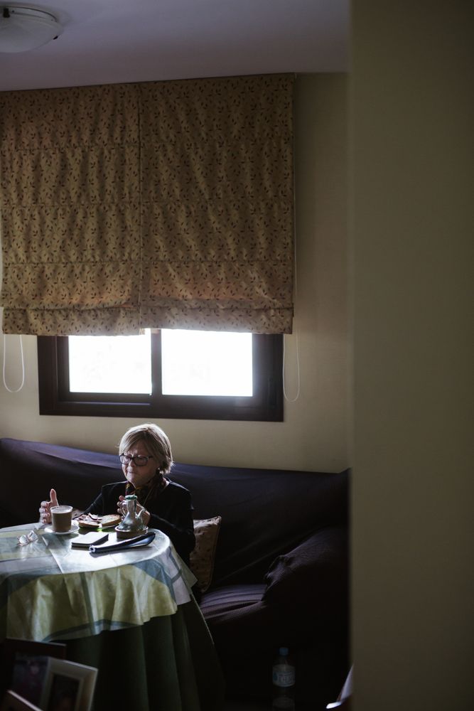 Older woman having breakfast