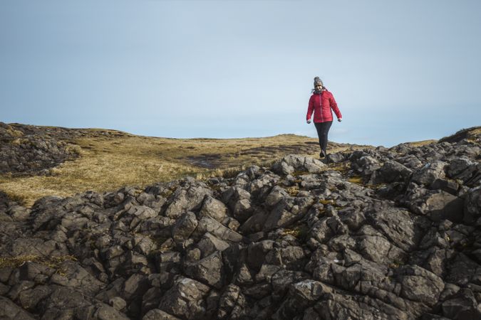 Woman walking along mountain