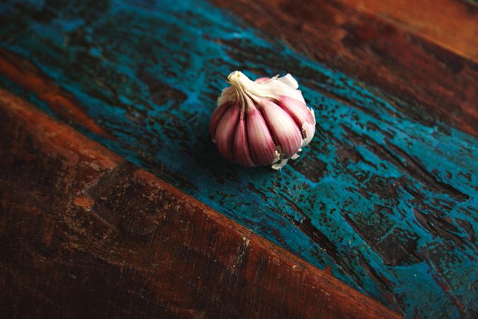 Purple garlic bulb on wooden table