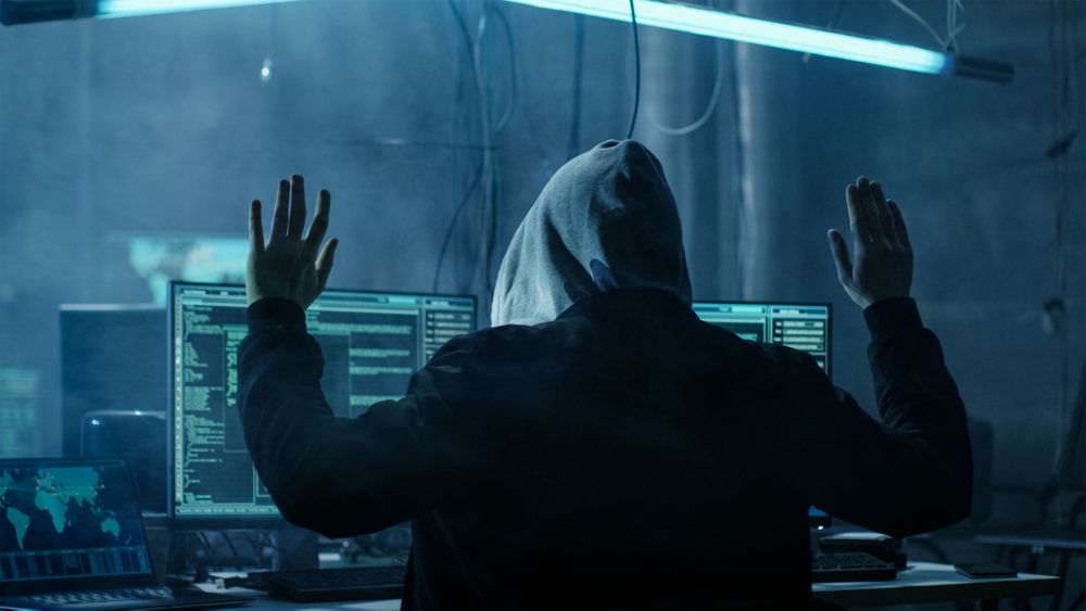 Hacker with Raised Handed.