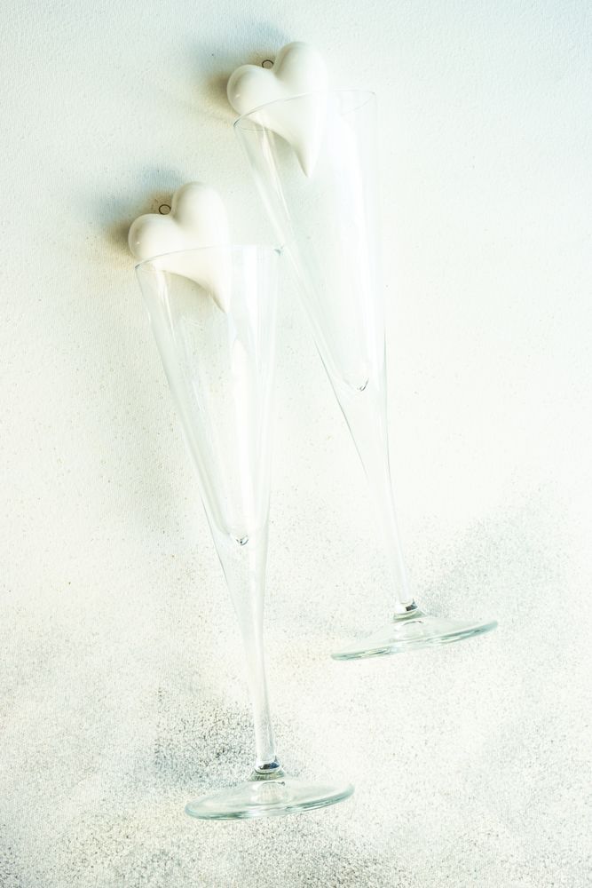 Two fluted of champagne with ceramic heart ornament