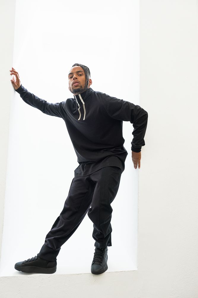 Dancing Black male with braids