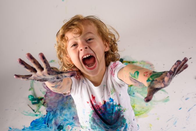 Playful boy with dirty hands