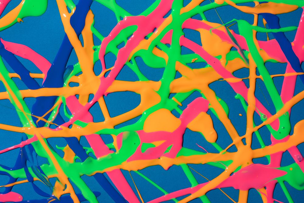 Pattered bright paint on blue background
