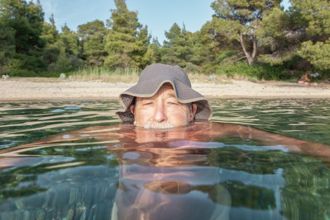 Man swimming under water in sea