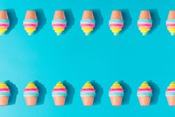 Pattern of colorful rows of ice cream on bright blue background