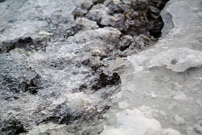 Melted snow crust over rocks