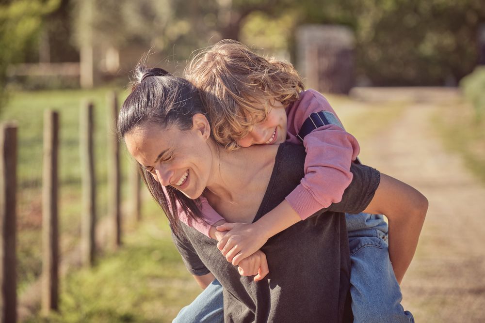 Happy mother and son in countryside