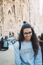 Smiling female tourist on city street