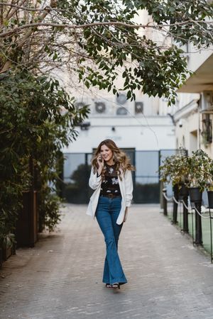 Woman talking phone on street
