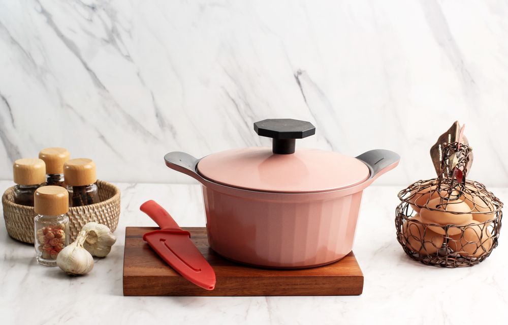 Pink Cooking Pot with various Spice and Eggs