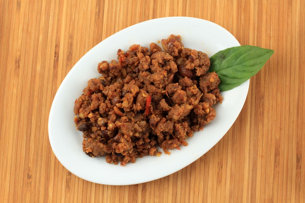 Top view of plate of tumis oncom, Indonesian dish of stir fried tempeh