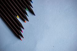 Coloring pencils on light blue background