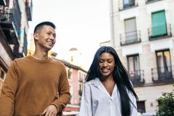 Interracial friends walking down the street