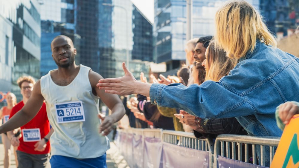 Marathon Audience Clapping and Cheering Their Loved Ones Participating in the Race