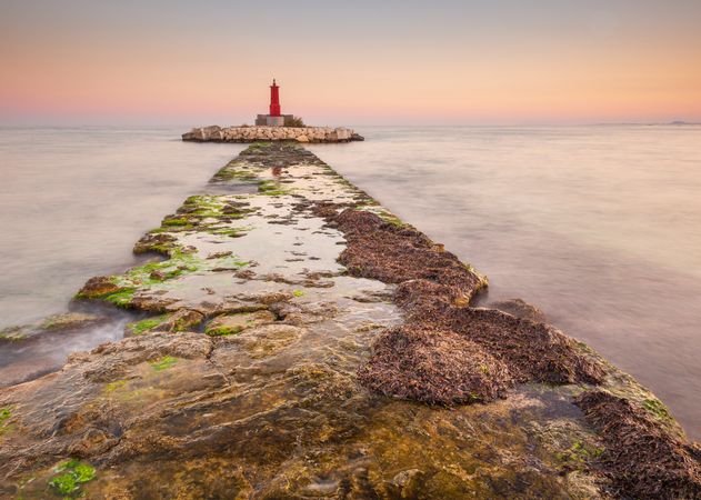 Rough path to islet with lighthouse