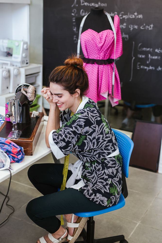 Woman in a sewing school